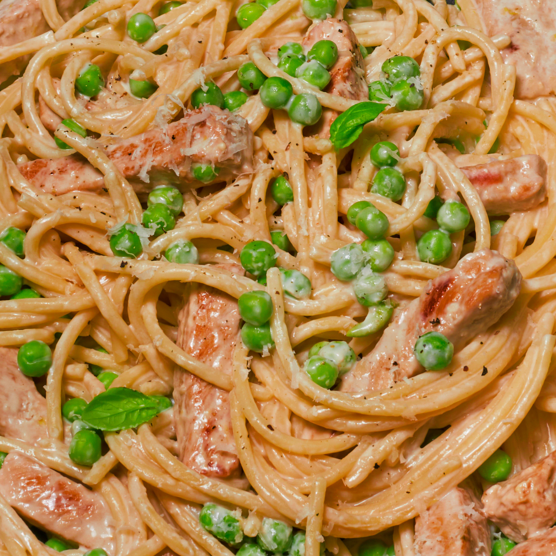 Up close shot of Creamy Lemon Pork Pasta with Peas