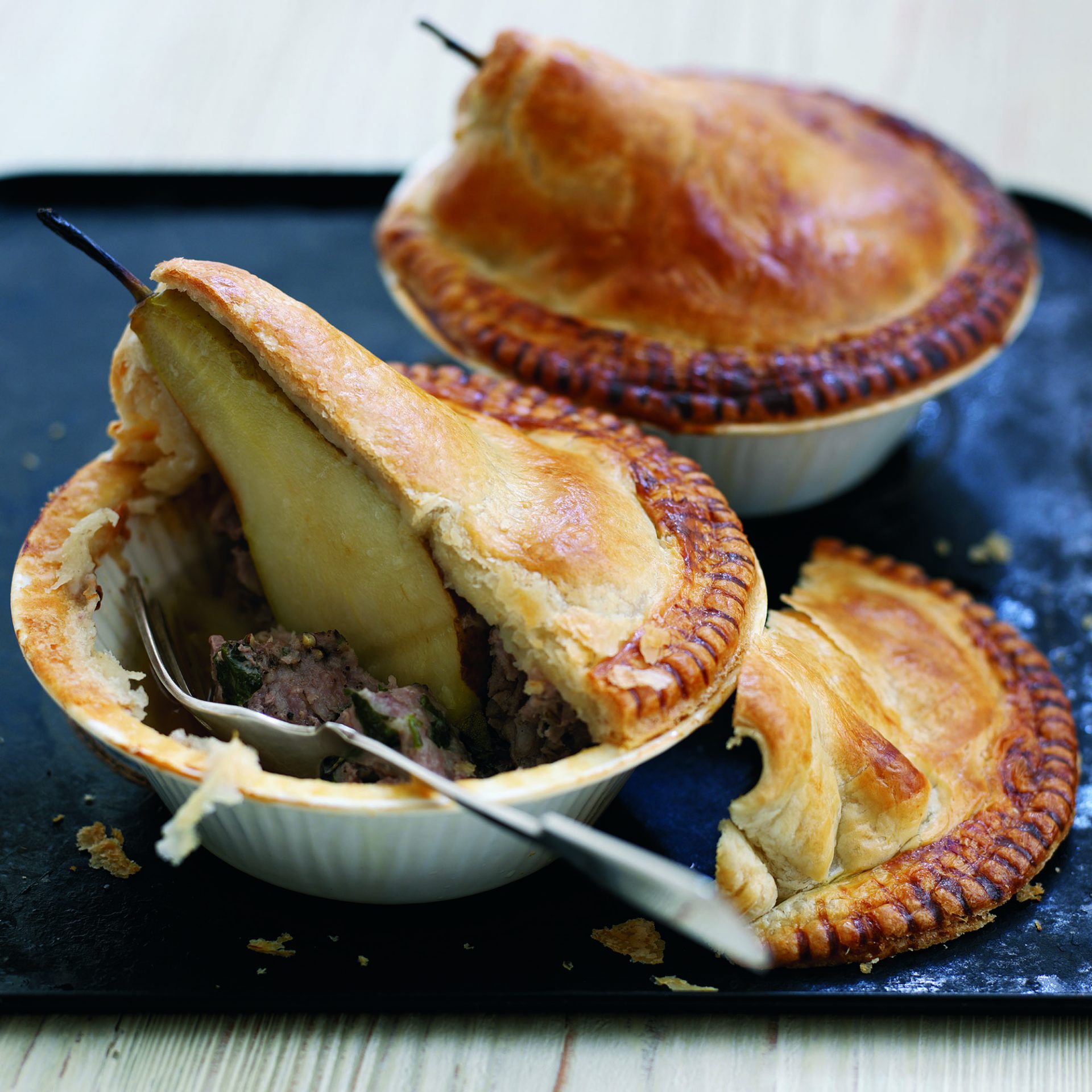 Two small white ramekins with fidget pies in