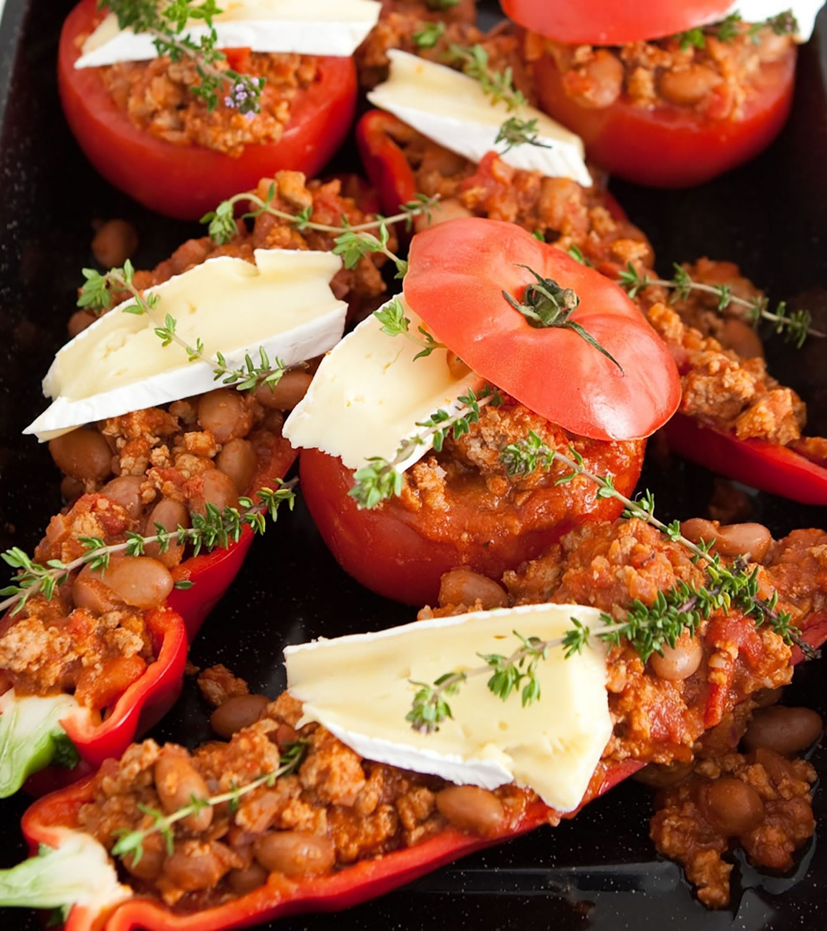 Pork chilli stuffed Mediterranean vegetables with cheese on top