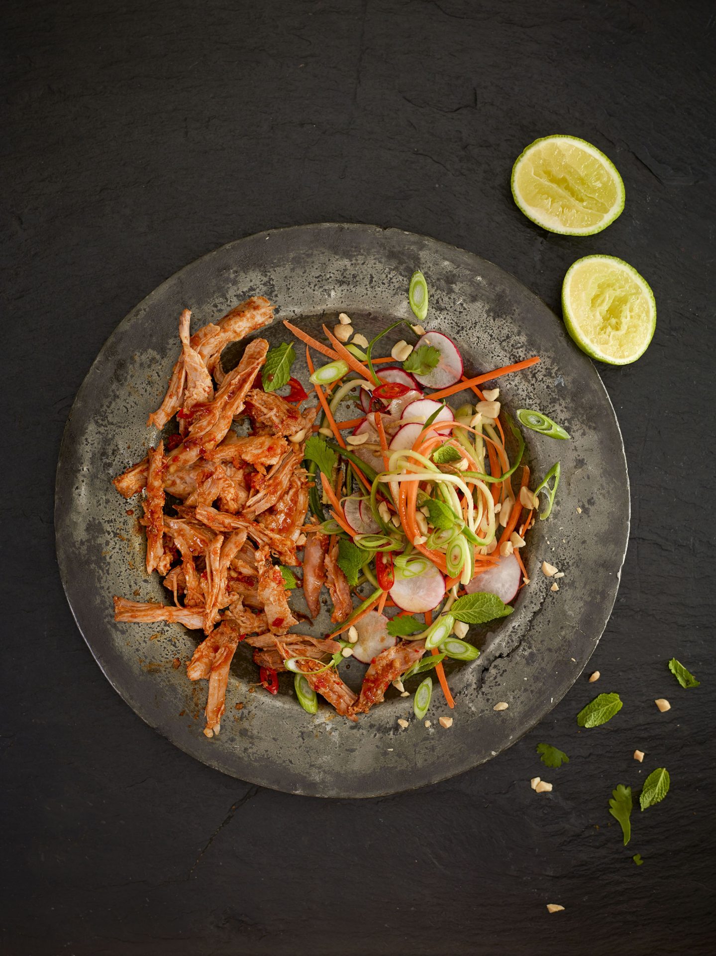 Thai pulled pork with asian slaw on a slate plate