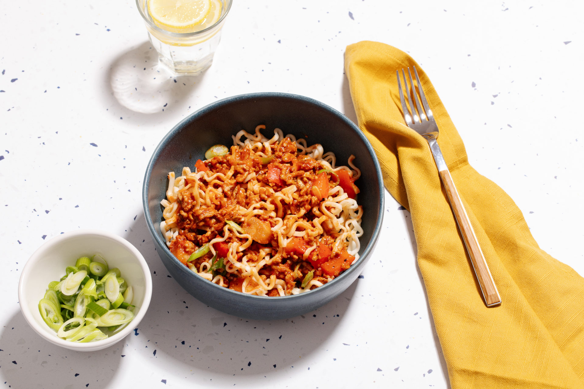 Bowl of Sweet and Sour pork mince with noodles.